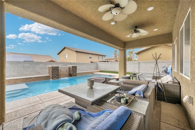 view of patio with a fenced backyard, a fenced in pool, an outdoor living space, and a ceiling fan