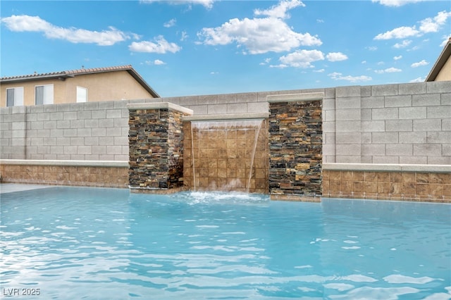 exterior space featuring a fenced in pool