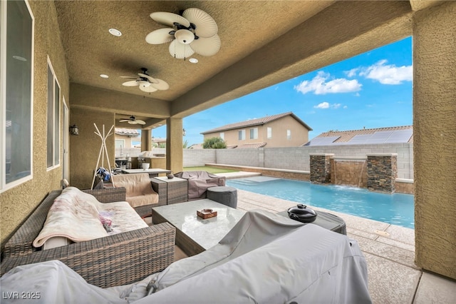 view of pool with a fenced in pool, a patio, an outdoor living space with a fire pit, ceiling fan, and a fenced backyard