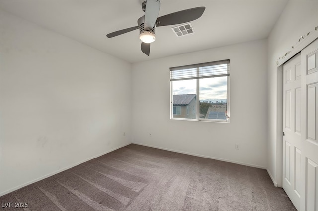 unfurnished bedroom featuring ceiling fan, carpet floors, visible vents, baseboards, and a closet