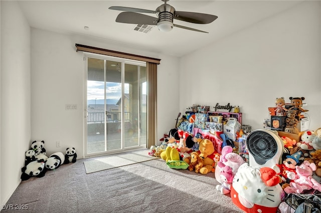 game room with ceiling fan, visible vents, and carpet flooring