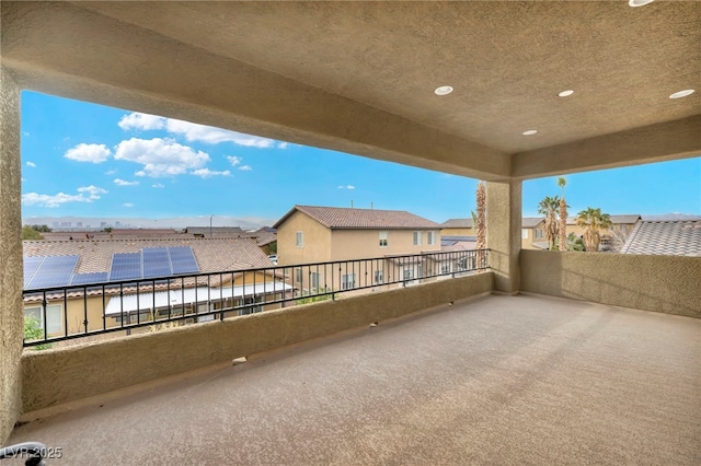 view of patio / terrace with a balcony and a residential view