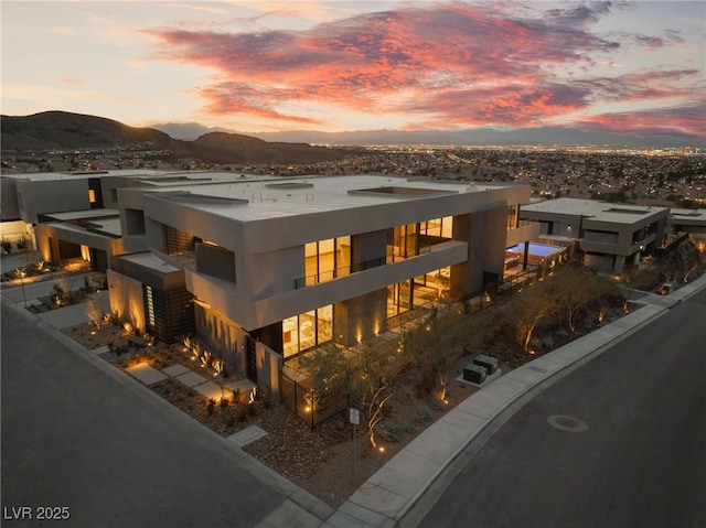 view of front of home featuring a mountain view and stucco siding