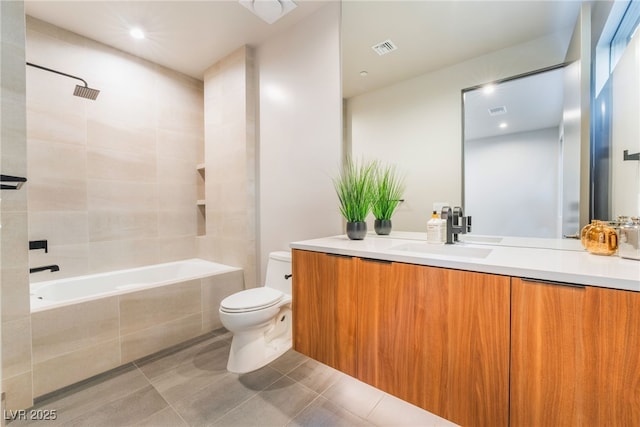 full bath featuring tile patterned flooring, toilet, tiled shower / bath combo, vanity, and visible vents