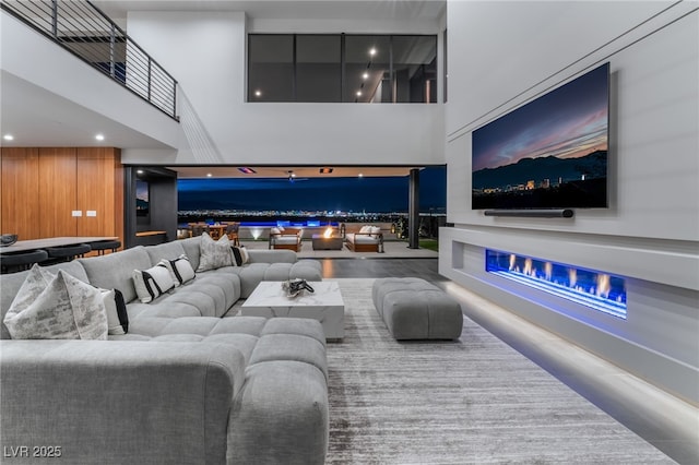 living area featuring recessed lighting and a high ceiling