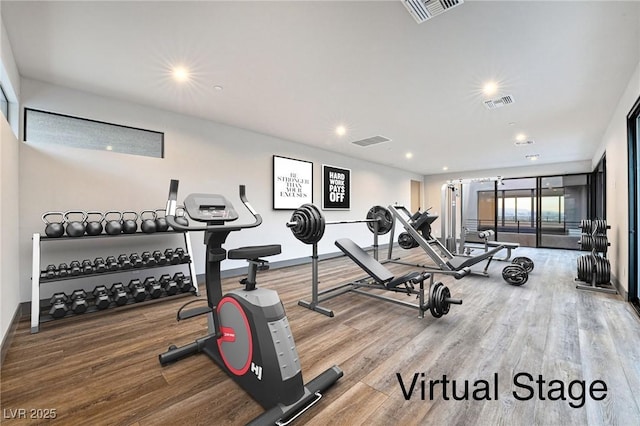 exercise room featuring recessed lighting, visible vents, and wood finished floors