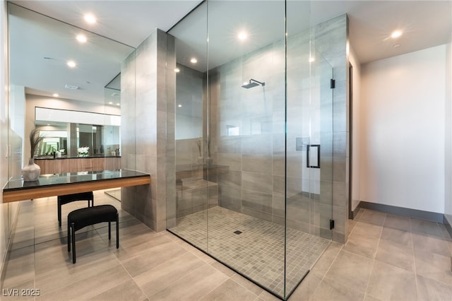 full bath featuring recessed lighting, a shower stall, baseboards, and tile patterned floors