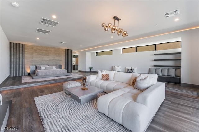 living area featuring wood finished floors, visible vents, and recessed lighting