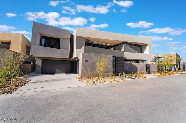 801 Dragons Eye Dr, Henderson, NV 89012 - view of front of home featuring a garage, stucco siding, and driveway