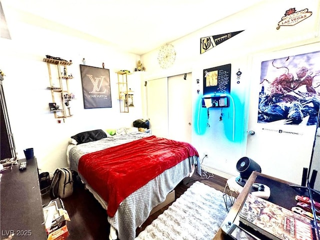 bedroom with a closet and wood finished floors