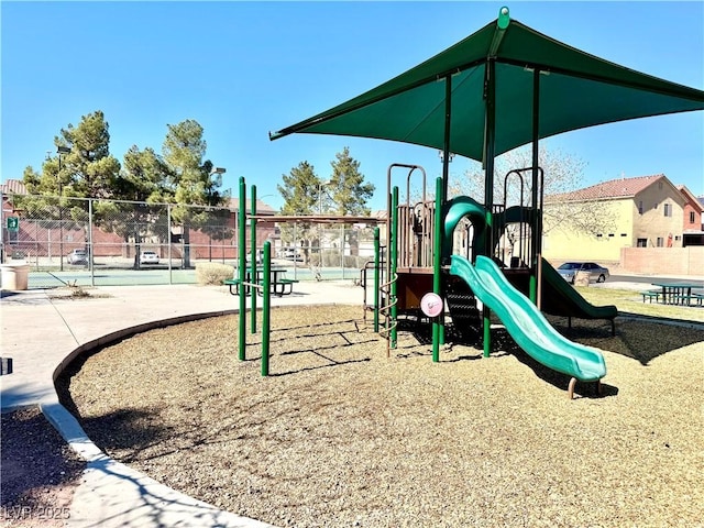 community jungle gym featuring fence