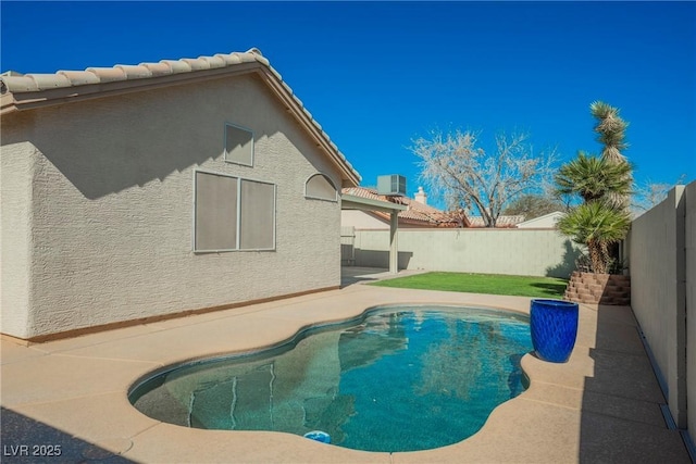 view of swimming pool featuring a fenced in pool, cooling unit, a patio area, and a fenced backyard