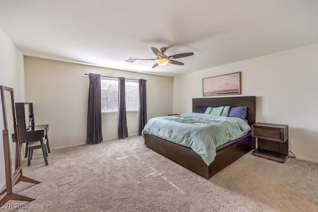 bedroom with baseboards, a ceiling fan, visible vents, and light colored carpet