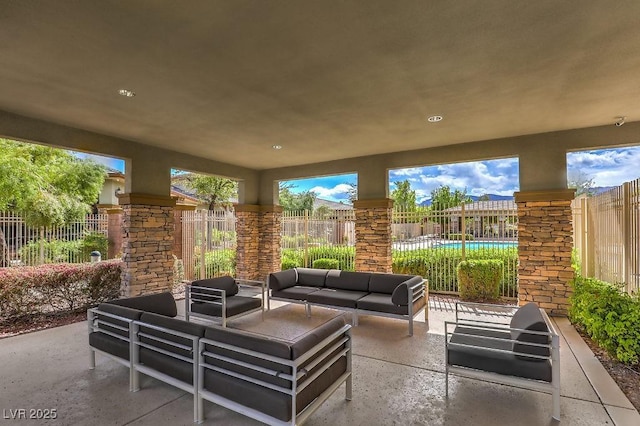 view of patio / terrace with fence and an outdoor living space