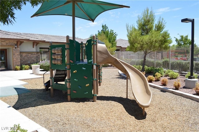 communal playground featuring fence