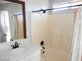 full bath with vanity and shower / tub combo with curtain