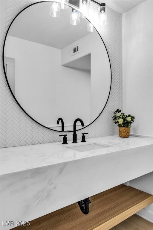 bathroom featuring visible vents and vanity