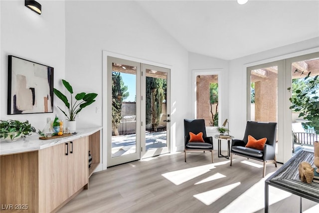 sunroom / solarium with vaulted ceiling and french doors