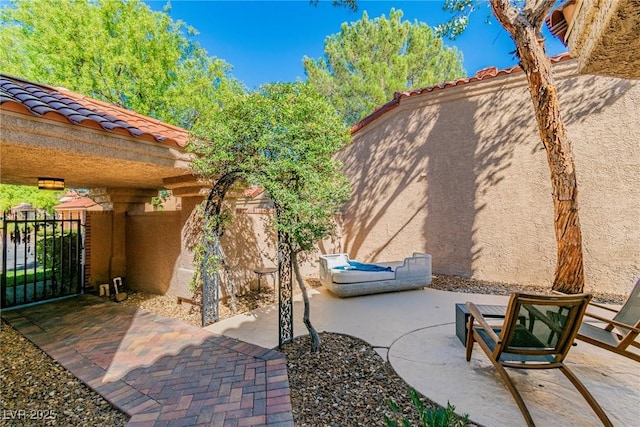 view of patio featuring fence