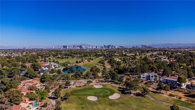 aerial view featuring view of golf course and a view of city