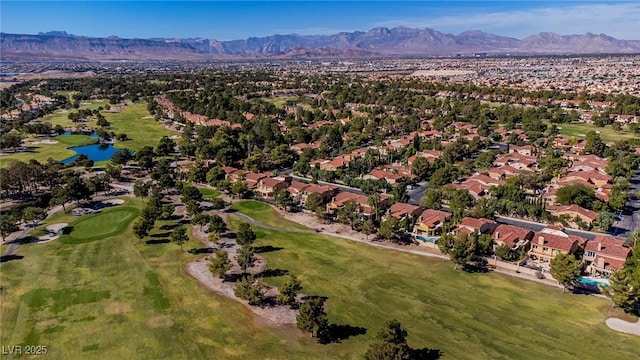 birds eye view of property with view of golf course, a residential view, and a water and mountain view