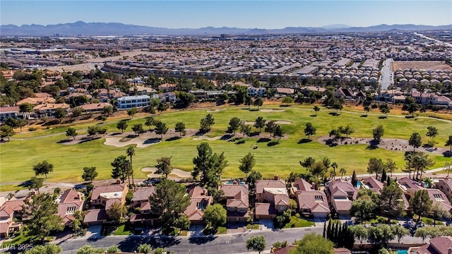 birds eye view of property with a residential view, view of golf course, and a mountain view