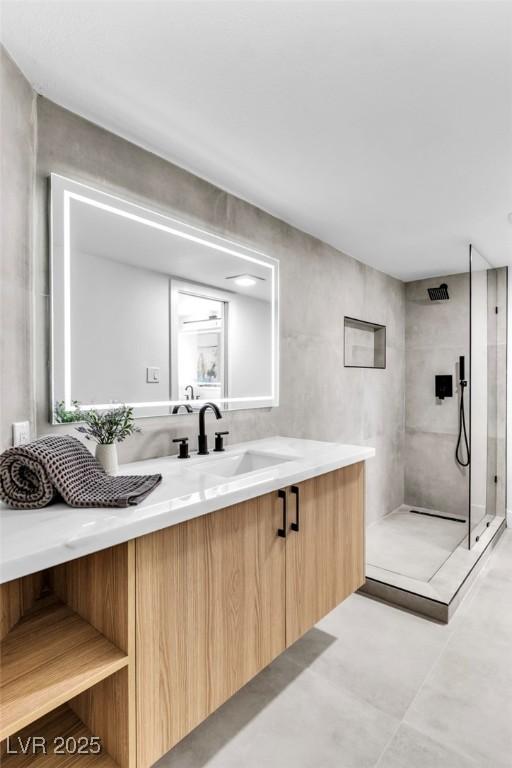 full bathroom with walk in shower and vanity