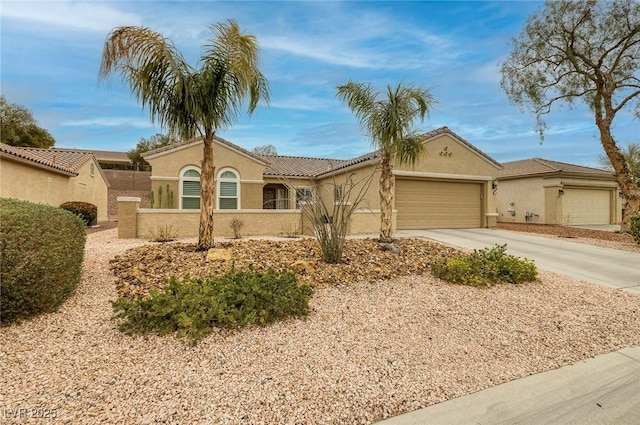 view of front of property with concrete driveway, a garage, and stucco siding