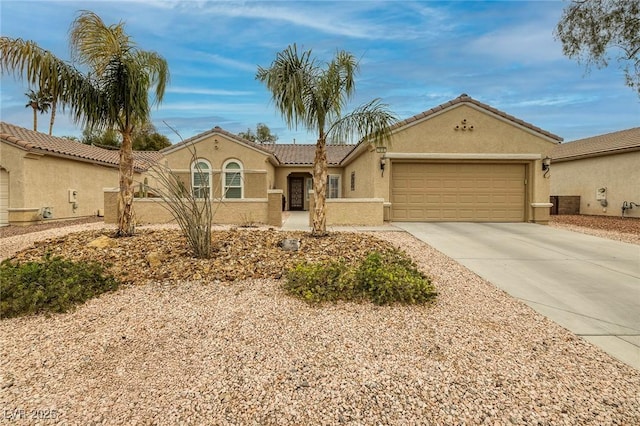 view of front of home with a tile roof, stucco siding, concrete driveway, and a garage