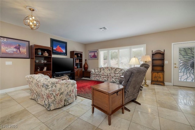 living room with light tile patterned floors, visible vents, baseboards, and an inviting chandelier