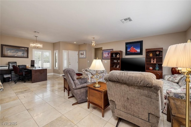 living room featuring light tile patterned flooring, a notable chandelier, baseboards, and visible vents