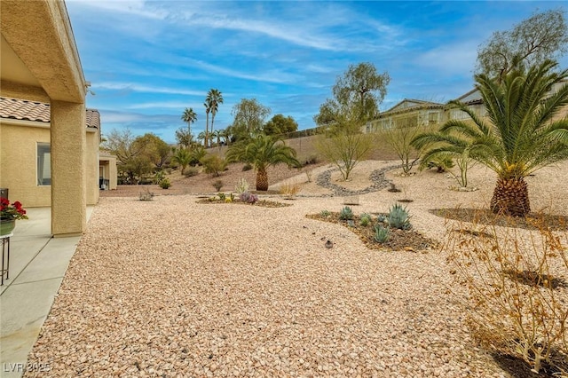 view of yard with fence and a patio area