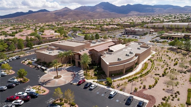 birds eye view of property with a mountain view and a residential view