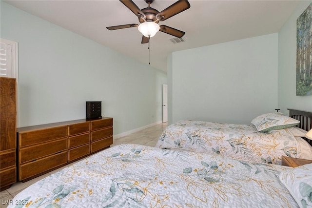 bedroom with tile patterned floors, visible vents, baseboards, and ceiling fan