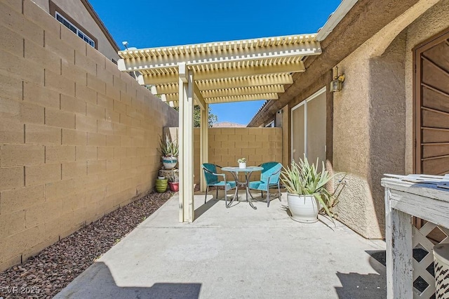 view of patio with a fenced backyard and a pergola