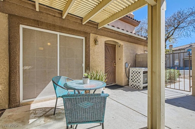 view of patio / terrace featuring fence