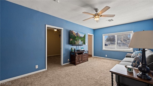 interior space with carpet floors, visible vents, a ceiling fan, and baseboards