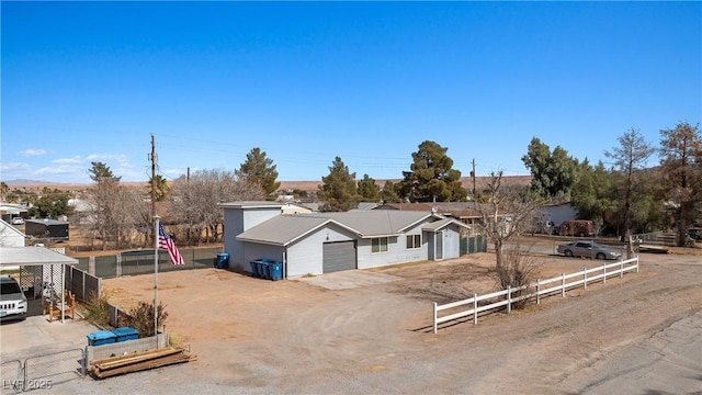 single story home with fence, driveway, and an attached garage