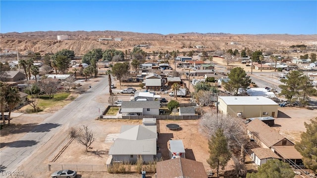 birds eye view of property featuring a mountain view and a residential view