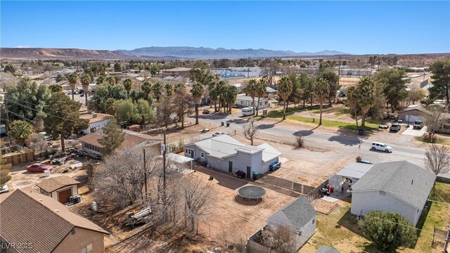 birds eye view of property with a mountain view and a residential view