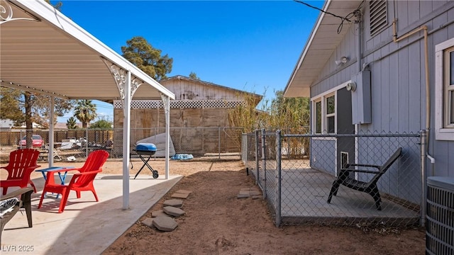 exterior space with a patio area and a fenced backyard