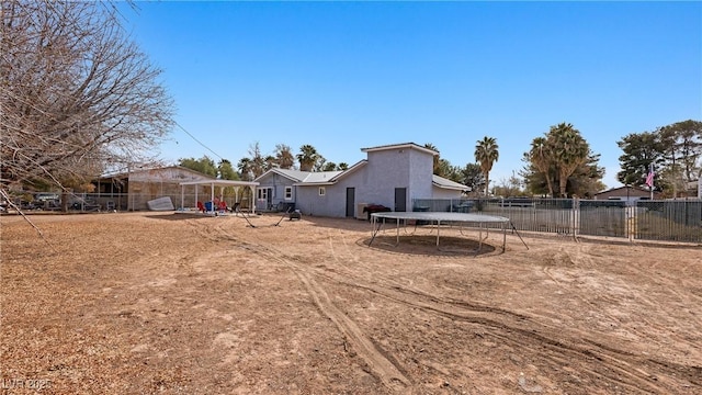 view of yard with a fenced backyard and a trampoline