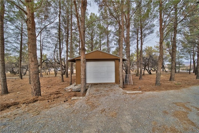 detached garage featuring driveway