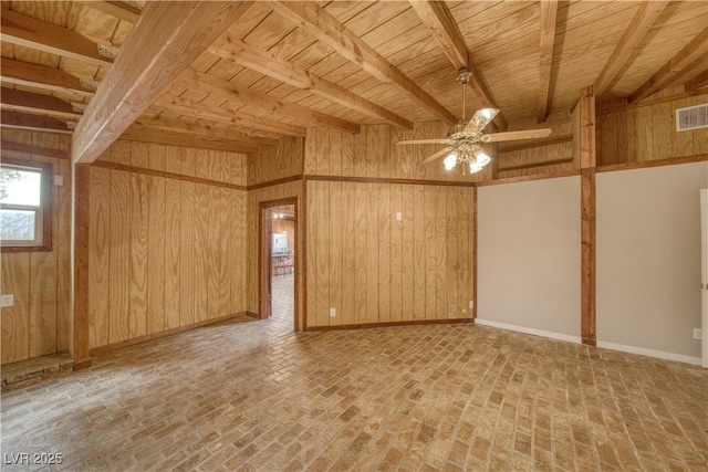 unfurnished room with brick floor, visible vents, and wooden walls