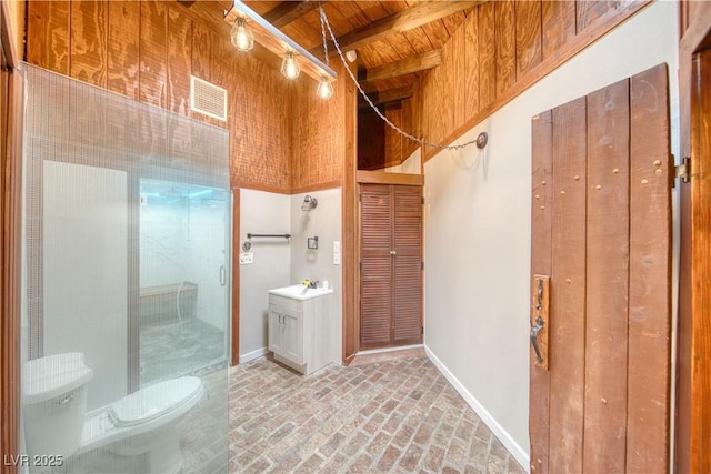 bathroom with visible vents, wooden ceiling, brick floor, a shower stall, and beam ceiling