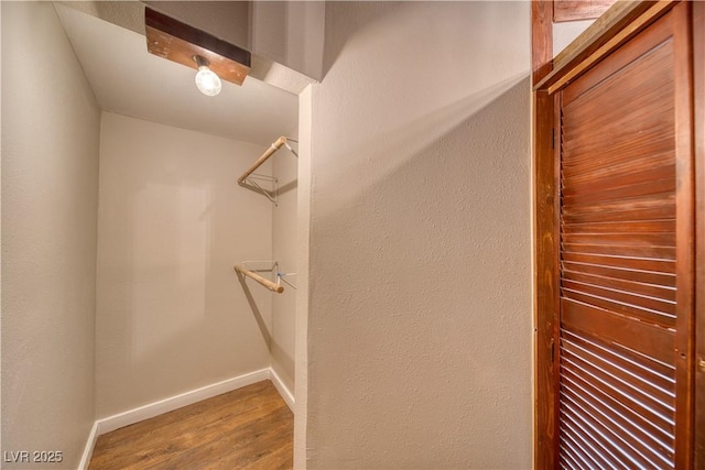 spacious closet with wood finished floors