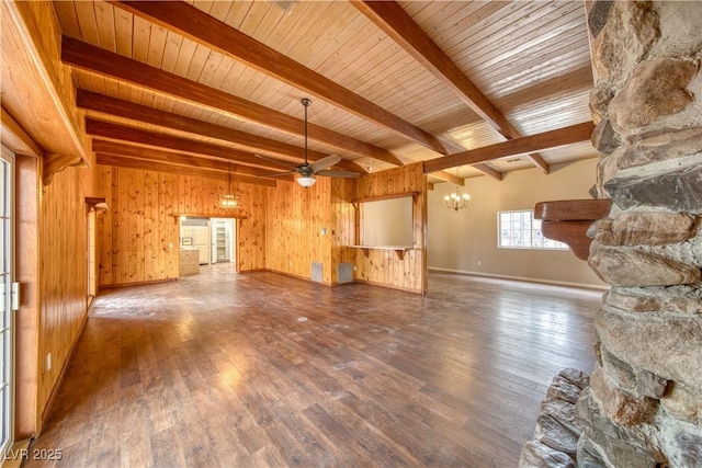 unfurnished living room featuring ceiling fan with notable chandelier, beamed ceiling, wood finished floors, and wooden walls