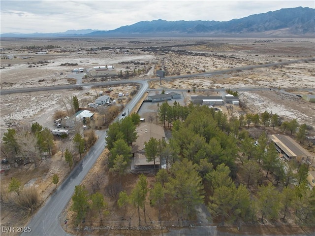 birds eye view of property featuring a mountain view