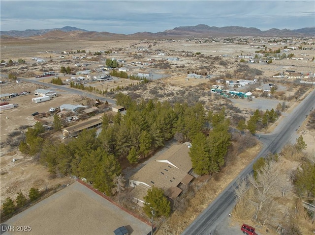 birds eye view of property with a mountain view