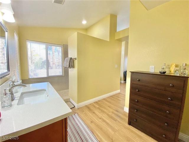 full bath with recessed lighting, wood finished floors, visible vents, vanity, and baseboards